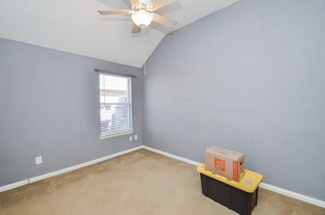 empty room with carpet, ceiling fan, and lofted ceiling