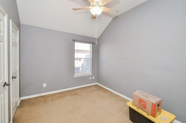 interior space featuring carpet floors, ceiling fan, and lofted ceiling