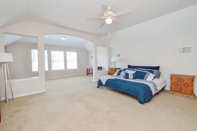 carpeted bedroom with vaulted ceiling and ceiling fan