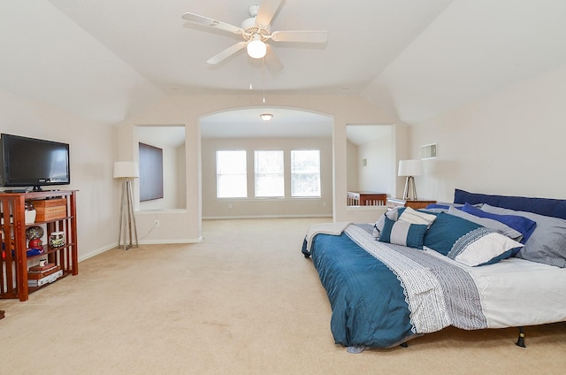 carpeted bedroom featuring ceiling fan and vaulted ceiling