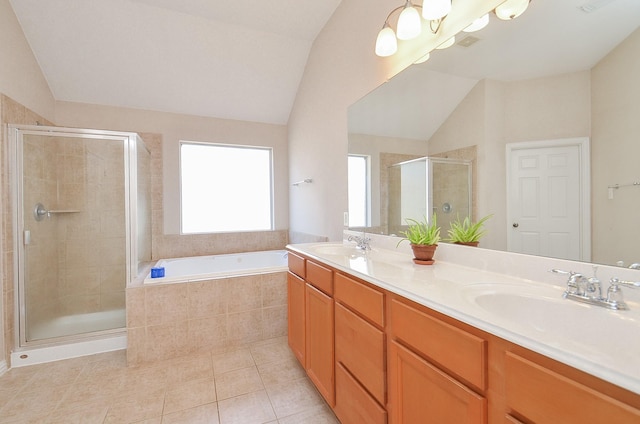 bathroom featuring tile patterned flooring, vanity, lofted ceiling, and plus walk in shower