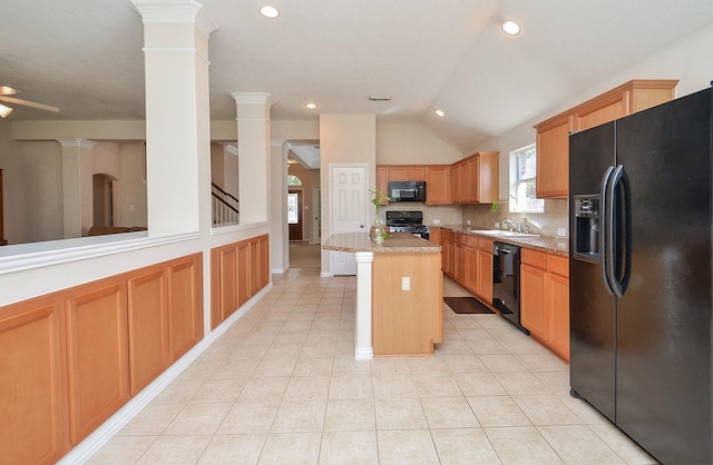 kitchen with tasteful backsplash, ceiling fan, black appliances, a center island, and lofted ceiling