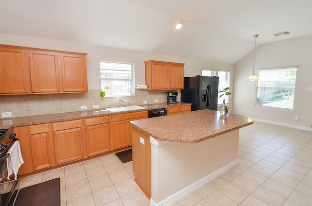 kitchen featuring sink, a center island, vaulted ceiling, light tile patterned flooring, and black appliances