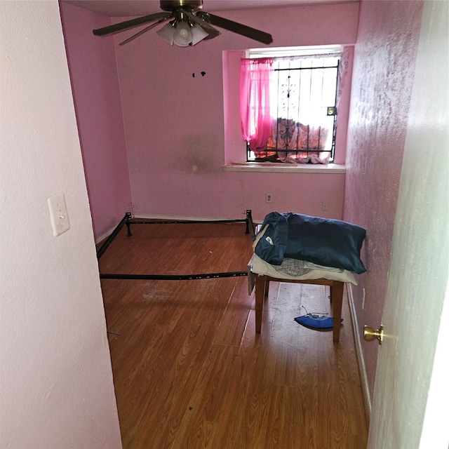 interior space with hardwood / wood-style flooring and ceiling fan