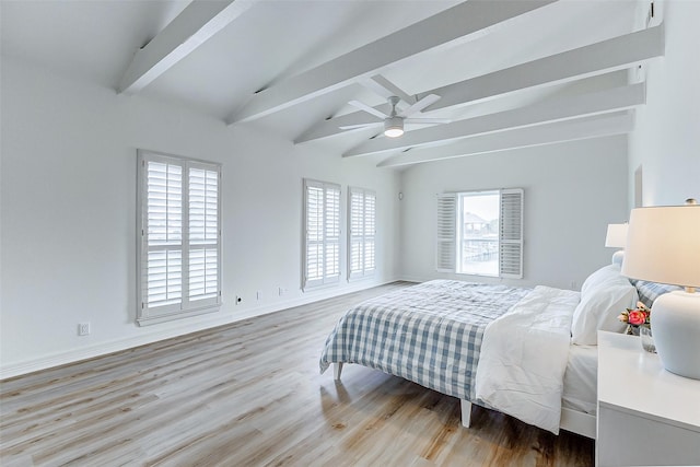 bedroom with light wood-type flooring, lofted ceiling with beams, and ceiling fan