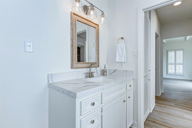 bathroom featuring vanity and hardwood / wood-style flooring