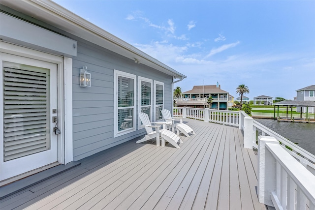 wooden deck with a water view