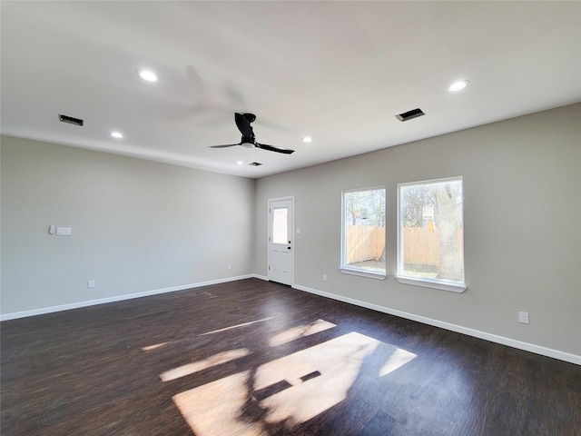 interior space featuring ceiling fan and dark hardwood / wood-style floors