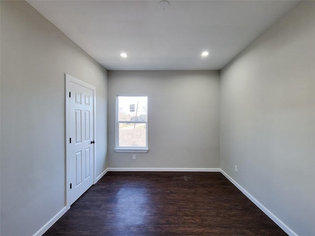 empty room with dark hardwood / wood-style floors