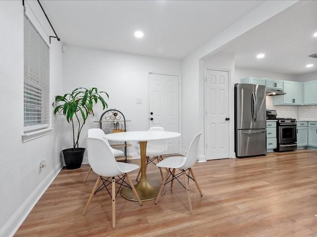 dining room with light hardwood / wood-style flooring