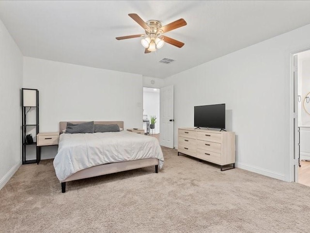 bedroom with ceiling fan and light carpet