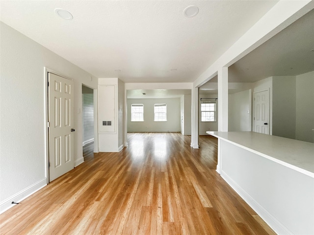 unfurnished living room featuring light hardwood / wood-style floors