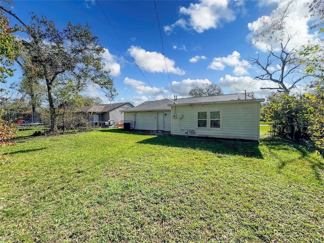 rear view of house with a lawn