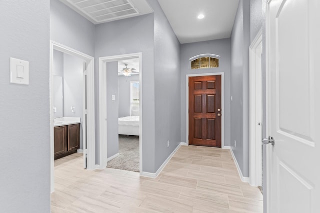 entrance foyer featuring ceiling fan