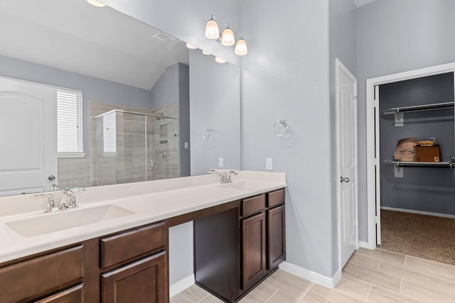 bathroom with vanity and an enclosed shower