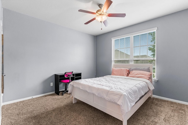 bedroom featuring ceiling fan and carpet