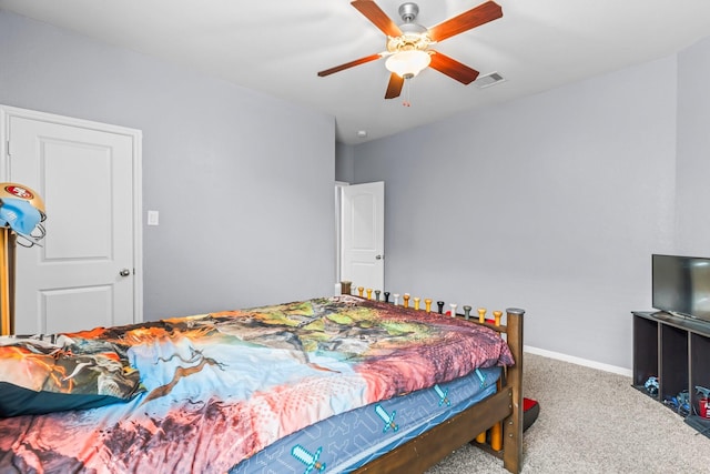 bedroom with ceiling fan and carpet floors