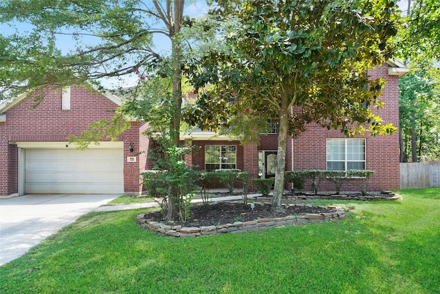 view of front of house with a garage and a front yard