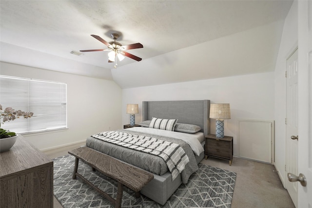 bedroom with ceiling fan, light carpet, and lofted ceiling