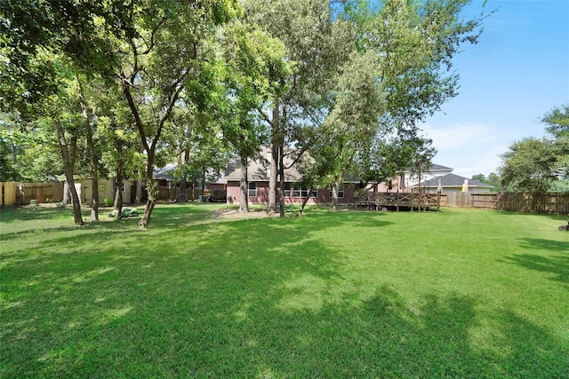 view of yard featuring a wooden deck