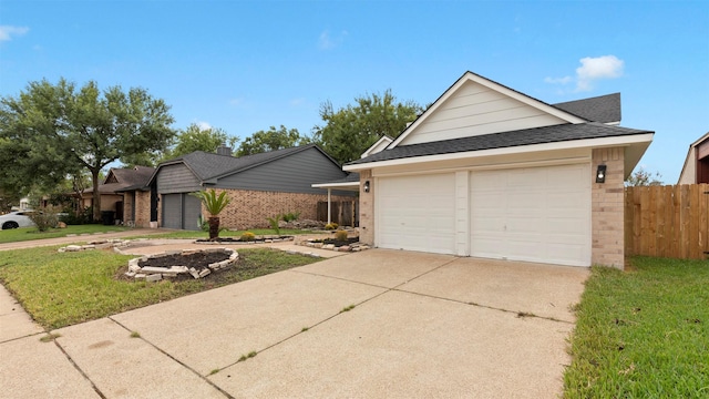 exterior space with a garage and a front lawn