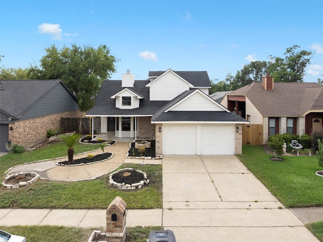 view of front facade featuring covered porch, a garage, and a front lawn