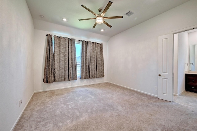 spare room with light carpet and ceiling fan