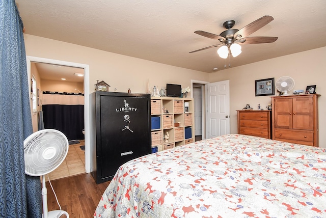 bedroom featuring ceiling fan and dark hardwood / wood-style flooring