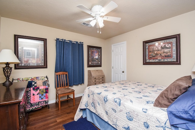 bedroom featuring ceiling fan and dark wood-type flooring