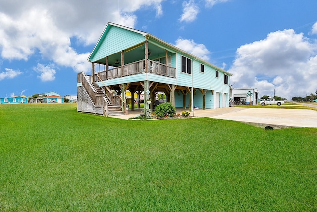 exterior space featuring a carport, a garage, and a front yard