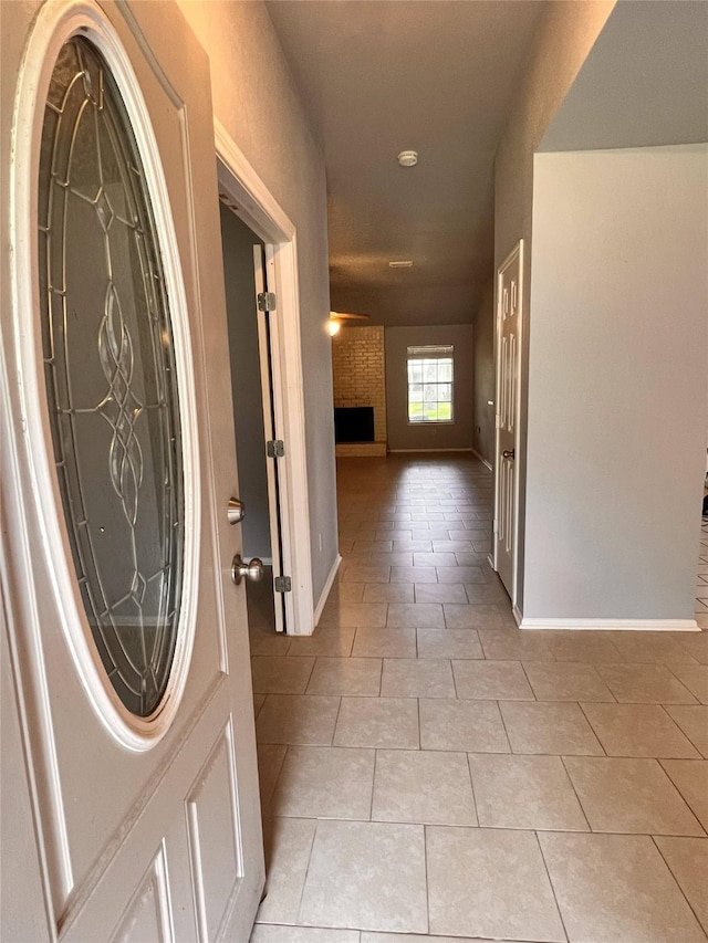 hallway featuring light tile patterned floors