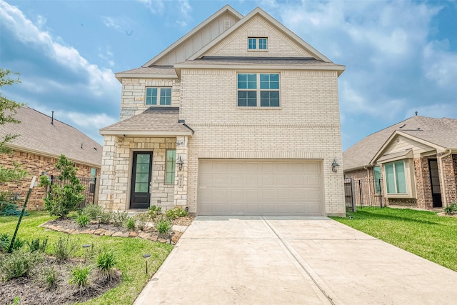 view of front of property with a garage and a front lawn