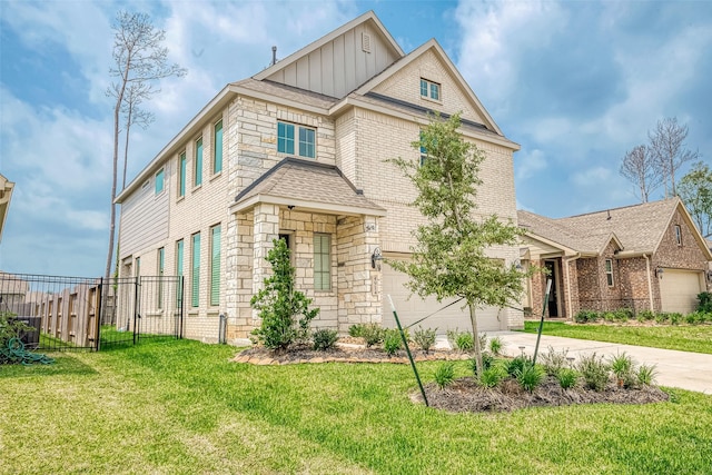 view of front of property with a garage and a front lawn