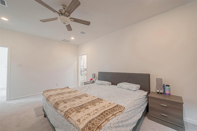 bedroom featuring light carpet and ceiling fan