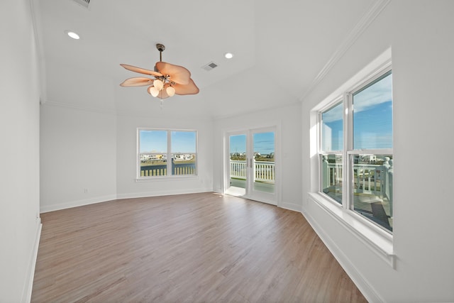 unfurnished room featuring baseboards, visible vents, light wood finished floors, recessed lighting, and ornamental molding