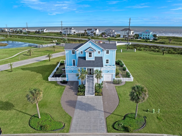 bird's eye view featuring a residential view and a water view