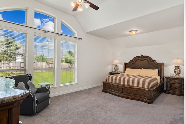 bedroom featuring ceiling fan, light colored carpet, and vaulted ceiling