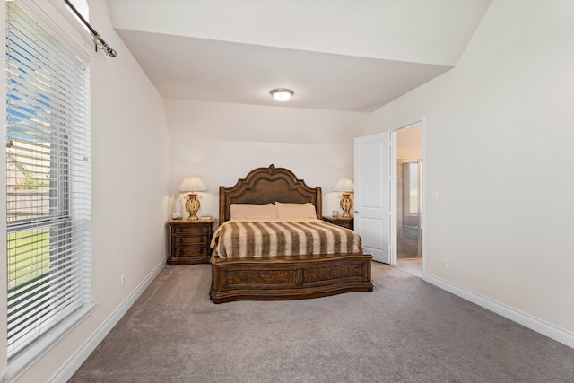 bedroom featuring light colored carpet