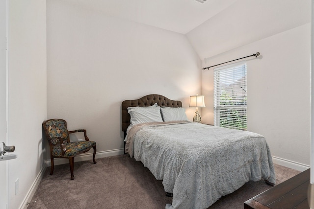 carpeted bedroom with vaulted ceiling