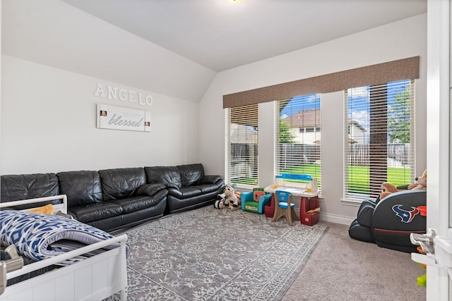 carpeted living room featuring vaulted ceiling