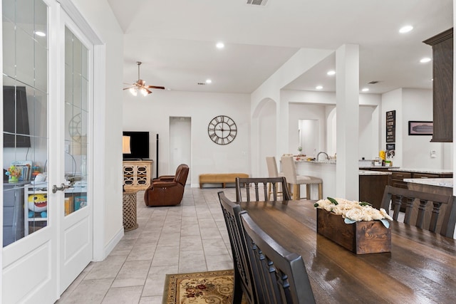 dining space featuring ceiling fan