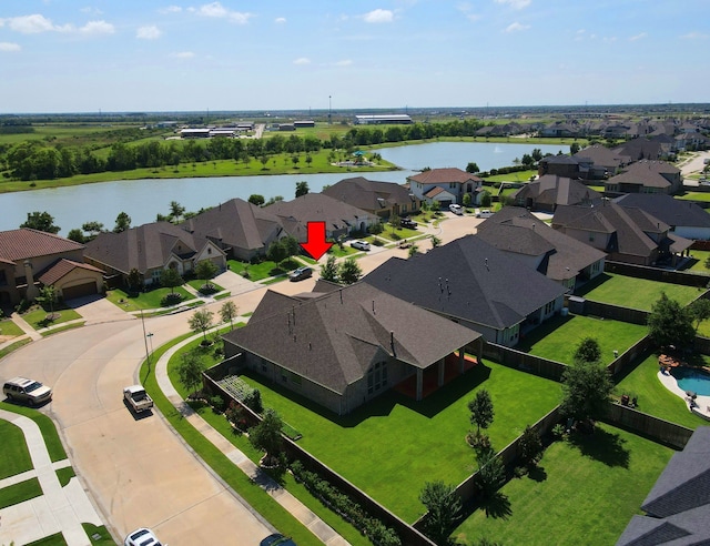 birds eye view of property featuring a water view