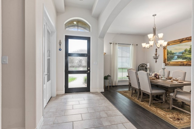 foyer featuring a chandelier and light wood-type flooring