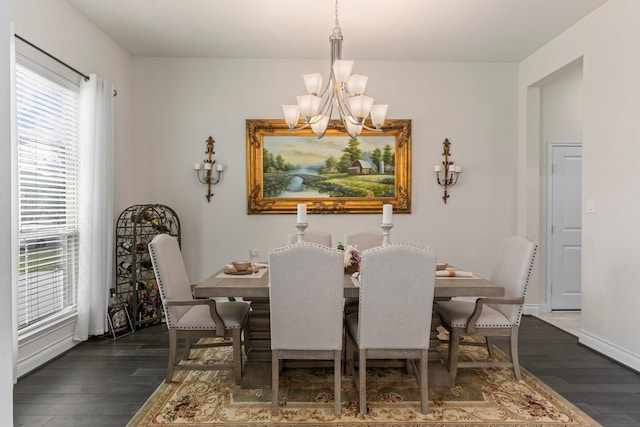 dining room featuring dark hardwood / wood-style flooring and a chandelier