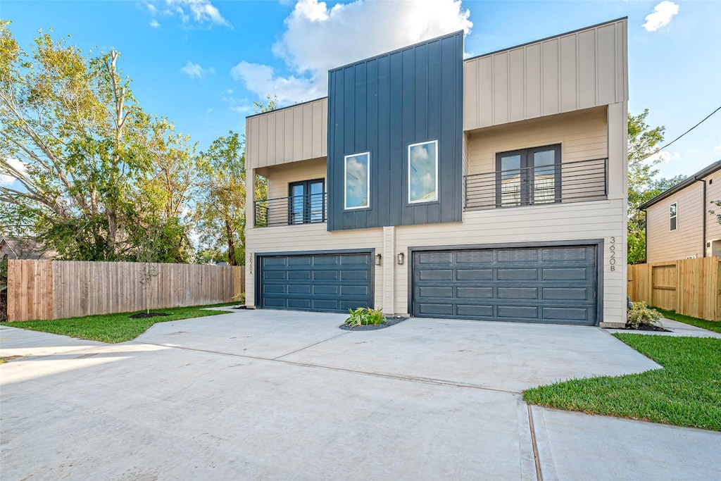 modern home featuring a balcony and a garage