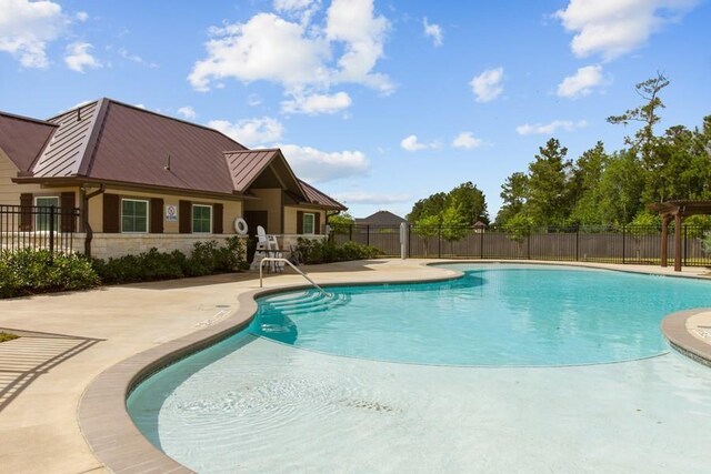 view of pool featuring a patio area, fence, and a fenced in pool