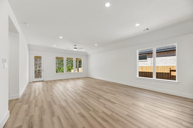 unfurnished room featuring light wood-style flooring, recessed lighting, visible vents, and baseboards