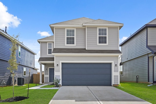 view of front property with a garage, central AC unit, and a front lawn