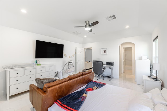 bedroom featuring ceiling fan and ensuite bath