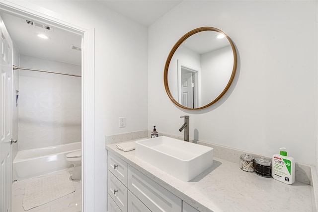 full bathroom featuring tile patterned floors, vanity, shower / bath combination, and toilet